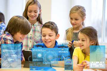 Image showing group of school kids with tablet pc in classroom