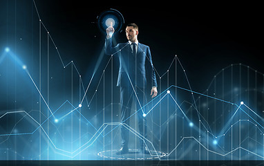 Image showing businessman in suit touching virtual graph