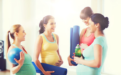 Image showing group of happy pregnant women talking in gym