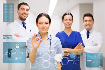 Image showing group of medics at hospital showing ok hand sign