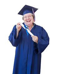 Image showing Happy Senior Adult Woman Graduate In Cap and Gown Holding Diplom