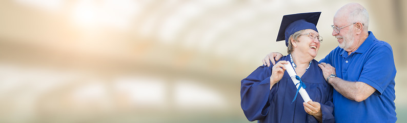 Image showing Banner of Senior Adult Woman Graduate In Cap and Gown Being Cong