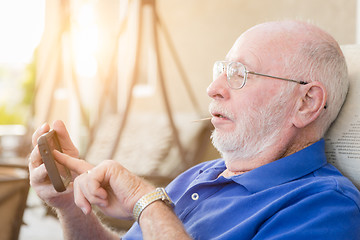 Image showing Senior Adult Man Using Smart Cell Phone.