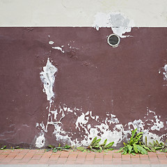 Image showing abandoned cracked stucco wall with ventilation grille