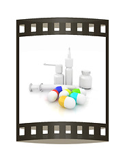 Image showing Syringe, tablet, pill jar. 3D illustration. The film strip