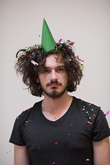 Image showing man blowing confetti in the air