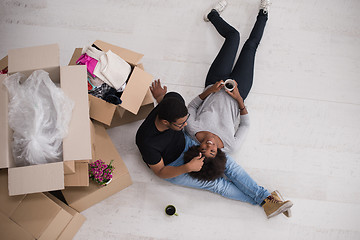 Image showing African American couple relaxing in new house