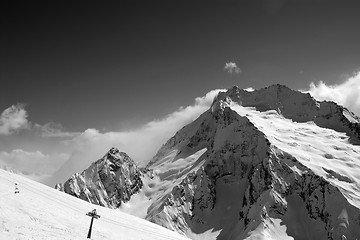 Image showing Black and white view on ski slope and snow mountain in winter