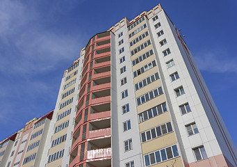 Image showing Top of high rise building on blue sky