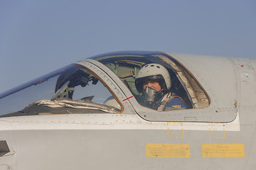 Image showing Military pilot in the cockpit of a jet aircraft