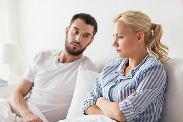 Image showing unhappy couple having conflict in bed at home