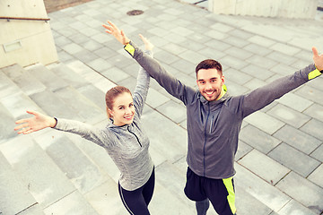 Image showing happy smiling couple outdoors on city street