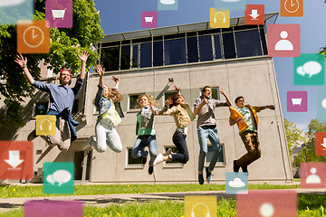 Image showing happy teenage students or friends jumping outdoors