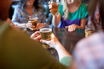 Image showing friends drinking beer at bar or pub