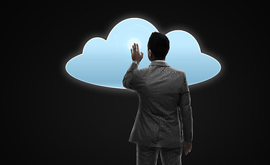 Image showing businessman working with virtual cloud projection