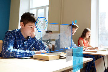 Image showing group of students with books writing school test