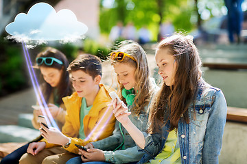 Image showing happy teenage friends with smartphones outdoors