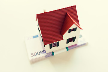 Image showing close up of home or house model and money