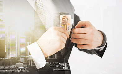 Image showing close up of businessman with euro money