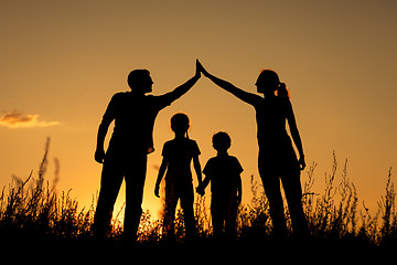 Image showing Happy family standing in the park.