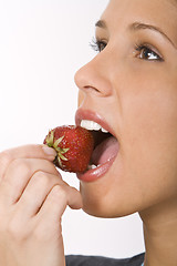 Image showing Bitting into a strawberry