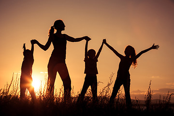 Image showing Happy family standing in the park.