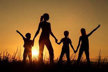 Image showing Happy family standing in the park.