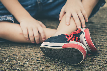 Image showing youth sneakers on boy legs on road 