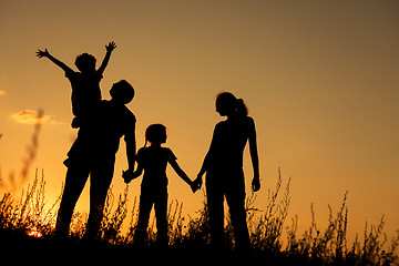 Image showing Happy family standing in the park.