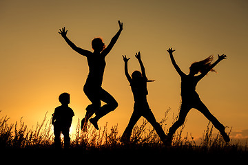 Image showing Happy family standing in the park.