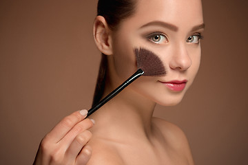 Image showing Beauty Girl with Makeup Brush. Perfect Skin. Applying Makeup