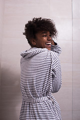 Image showing beautiful black woman wearing  bathrobe