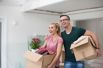 Image showing young couple moving into a new home