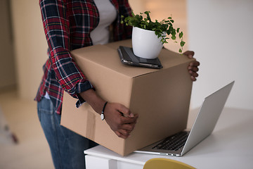 Image showing Black girl moving in the new apartment