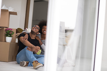 Image showing African American couple relaxing in new house