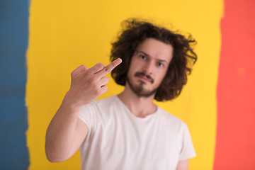 Image showing young man with funny hair over color background