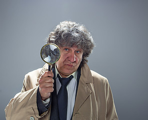 Image showing The senior man as detective or boss of mafia on gray studio background