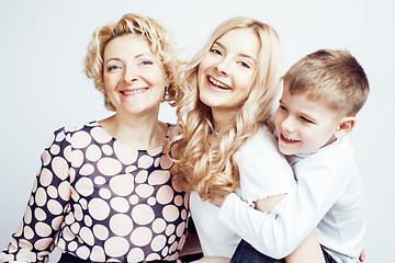 Image showing happy smiling family together posing cheerful on white background, lifestyle people concept, mother with son and teenage daughter isolated