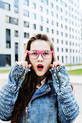 Image showing young pretty hipster girl student with coffee cup posing adorable smiling, lifestyle people concept outdoor