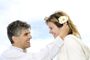 Image showing Mature romantic couple with flowers