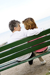 Image showing Mature romantic couple on a bench