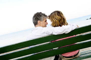 Image showing Mature romantic couple on a bench