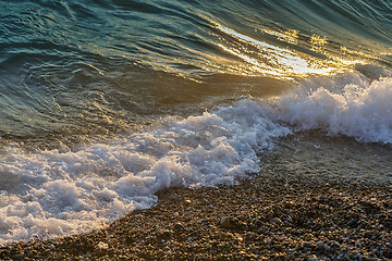 Image showing Surf wave on the beach in the evening.