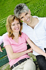 Image showing Mature romantic couple on a bench