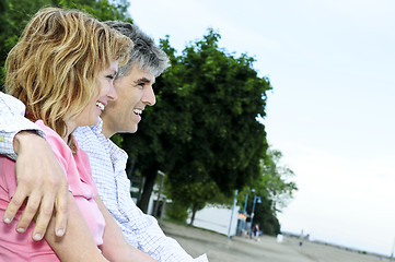 Image showing Mature romantic couple on a bench