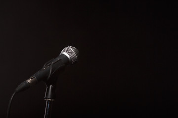 Image showing Microphone on empty black background