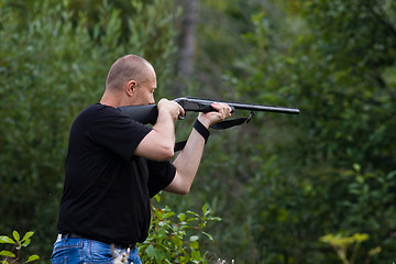 Image showing the shooter aiming from a gun at target