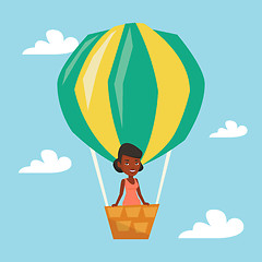 Image showing Woman flying in hot air balloon.