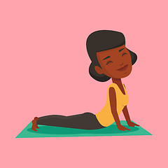 Image showing Woman practicing yoga upward dog pose.