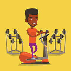 Image showing Man exercising on elliptical trainer.